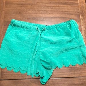 Green scalloped shorts